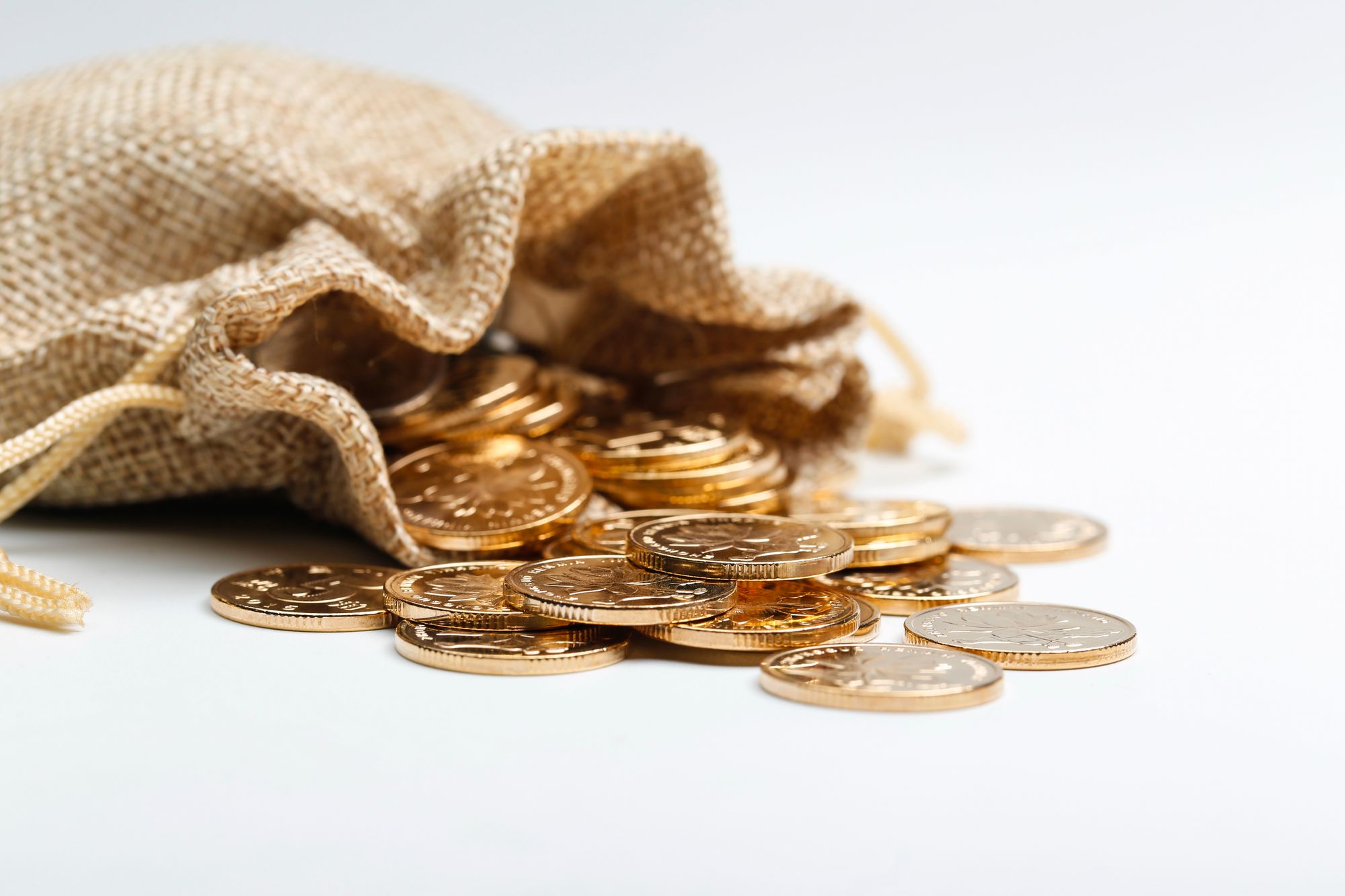 Coins spilling out of a bag