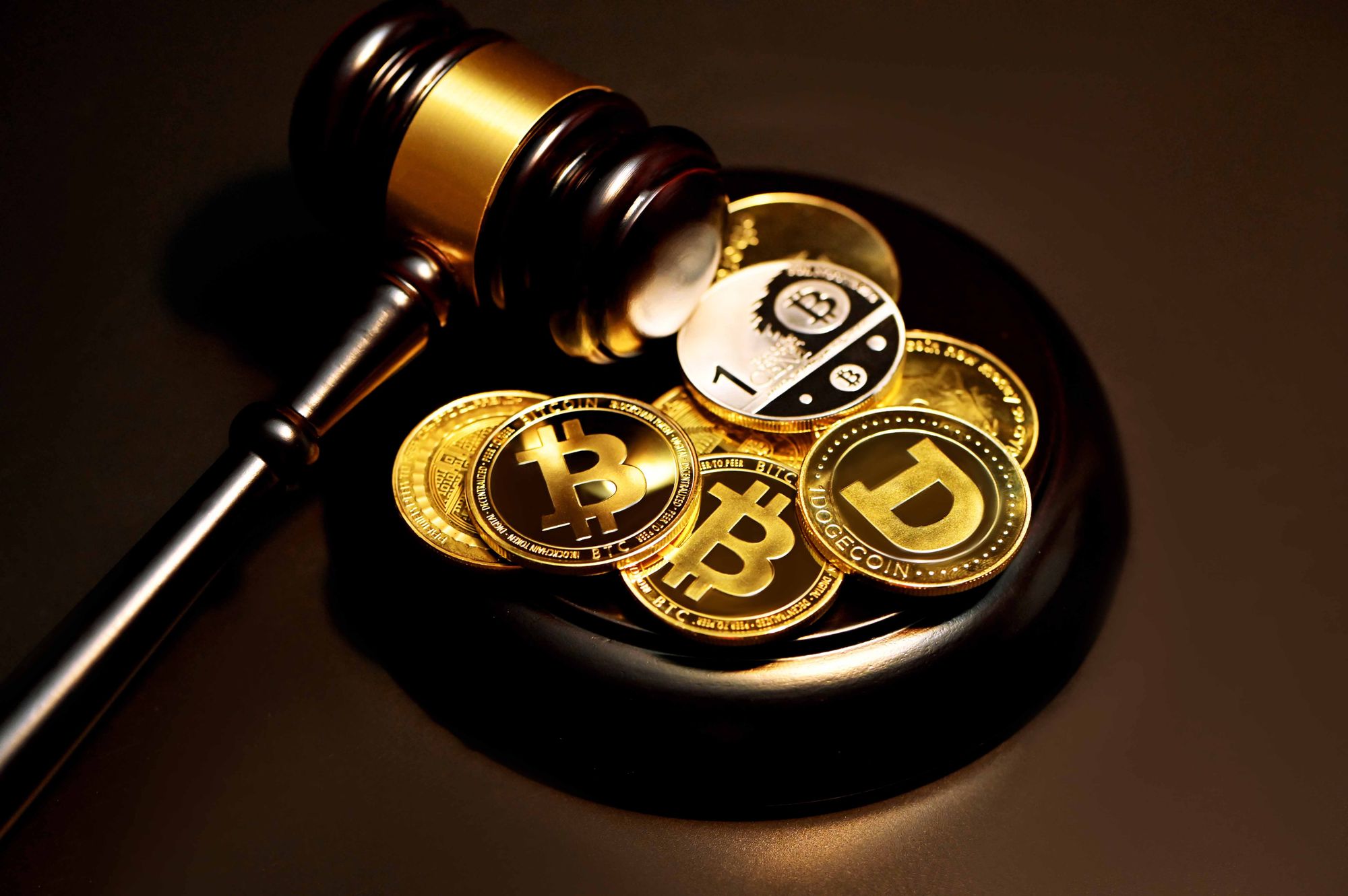 Cryptocurrencies next to a gavel
