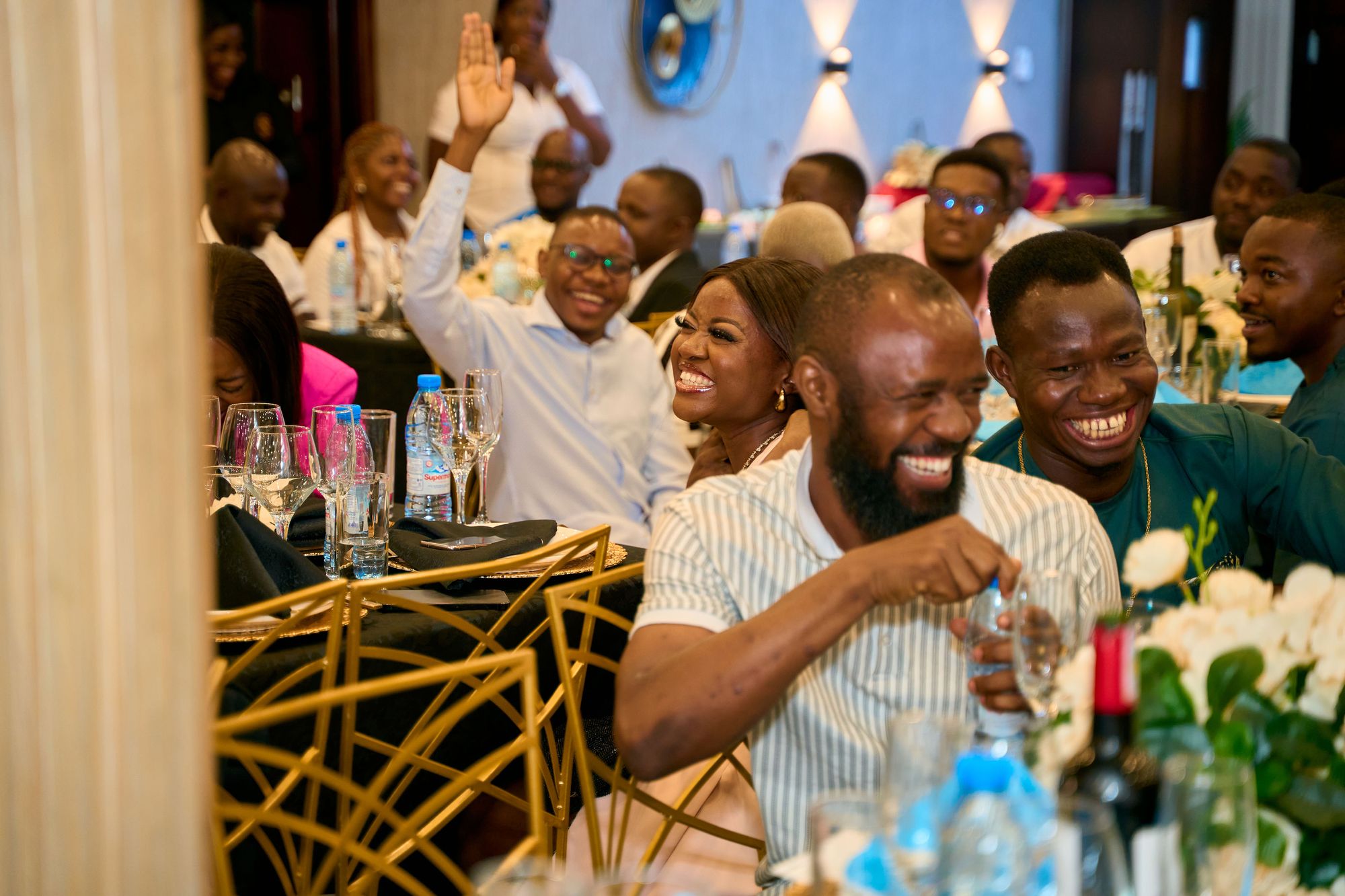 Obiex Central guests laughing at a joke 